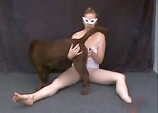 Pale lady takes off her pink undies to masturbate in front of a dog