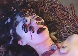 Insect fetish video with a girl eating sexy bugs on a bed of worms