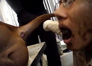 Nerdy babe gets covered in poo while licking dirty dog asshole