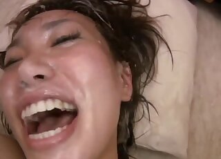 Japanese gal moans while getting licked by black Labradors