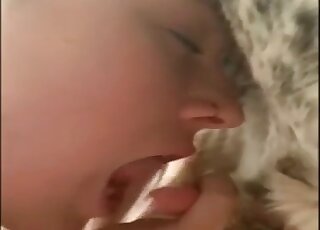 Attentive amateur licking all over this animal's hot penis in a BJ vid