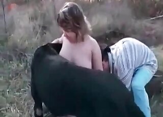 Good-looking chubby babe teasing a black dog in an outdoor vid