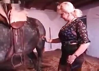 Filthy mom jerks off stallion’s dick and rubs her needy twat