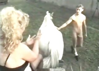 Fat zoophile female gives insane fisting to a horse in a zoo porn scene